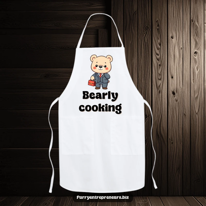 Cute bear character in a tiny suit shaking a briefcase on an apron, perfect for kitchen fun.